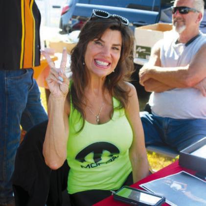 Miss D.C Connection, Claudia Abel, signs autographs.