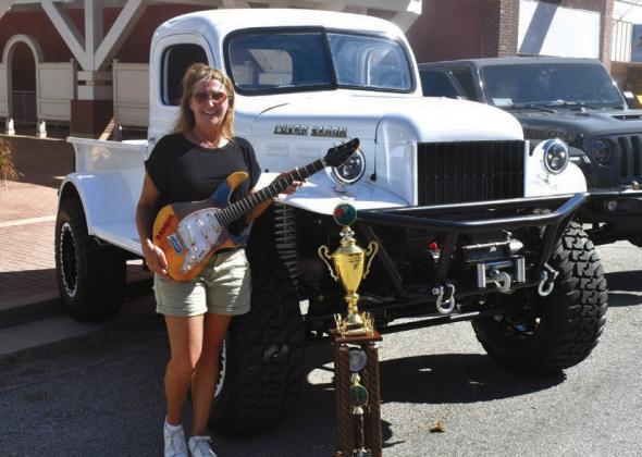 Kerri Somerville, of Edmond, won the B.A.M.F. (trophy) and Best of Show (guitar) awards for her white 1947 Dodge Power Wagon. courtesy photo