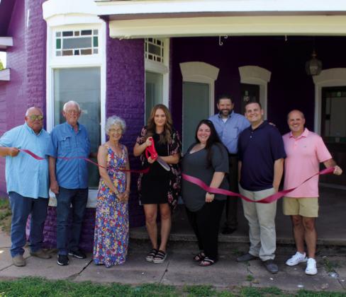 Ribbon cuttings held