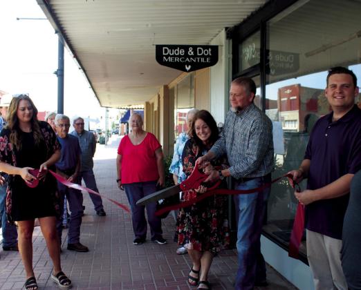 Ribbon cuttings held