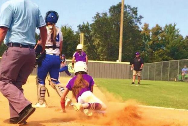 Kinzie Williams slides into home to score a run. courtesy photo