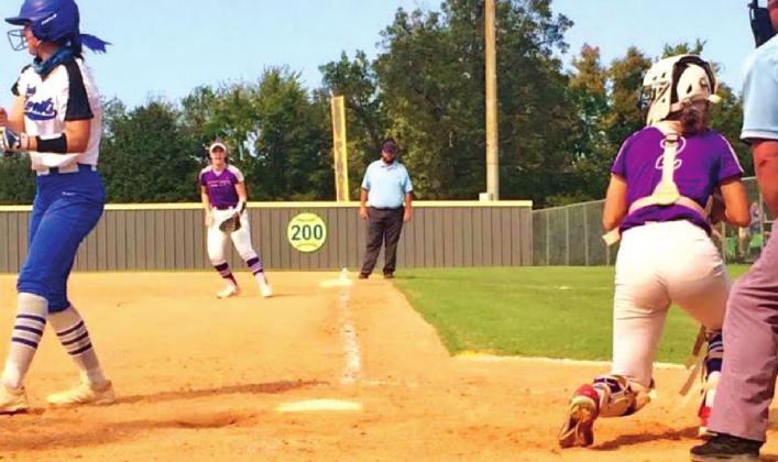 Lacy Moody looks to throw out a base runner as Mariah Moody looks on at first. courtesy photo