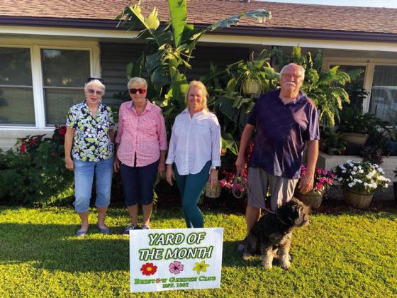 Tony and Amy Greenwood, 404 West 4th Street, were selected by the Bristow Garden Club for September Yard of the Month. Shown is Carolyn Kuykendall and Ruth Jaytaine, both with the Bristow Garden Club, Amy and Tony Greenwood with their fur baby, Ellie Mae. courtesy photo
