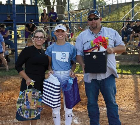 Senior Emily Moore with her parents Natalie and Aaron Moore. courtesy photo