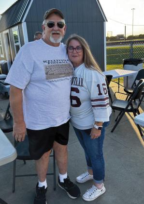 Darrell Means and Lisa Burgas Leathers representing her brother, Donald Burgas, Jr., by wearing his jersey.