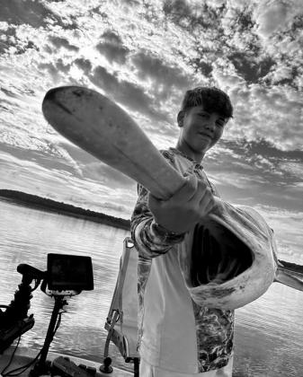 Will Brown with a paddlefish caught at Fort Gibson Lake courtesy photo