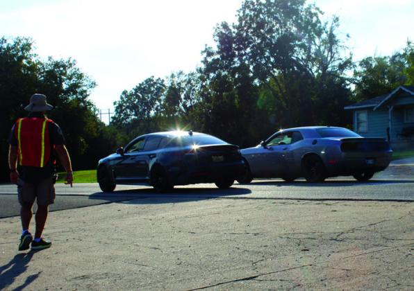 Cars raced each other to see who had the fastest vehicle.
