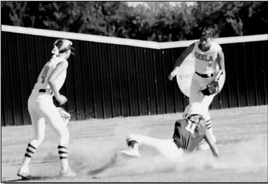 Hayden Haulcomb slides safely into second .