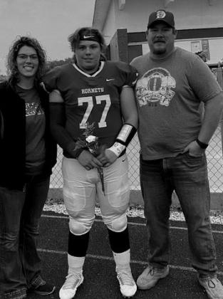 Christopher White with parents Joshua and Mattie White.