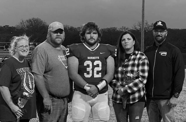 Seth McDaniel with parents Alisha Ernst and Jeremy McDaniel and Keri and Clint Cox