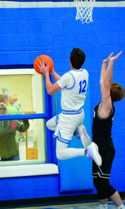 Carson Kinney jumps for the shot.