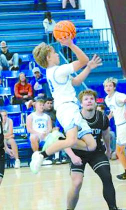 Wyatt Osburn and Gabe Peeler make a hoop shot.