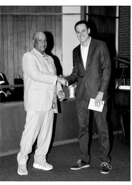 Odell Alexander presents the Celebrating Excellence Award to Jay Krumme. courtesy photo