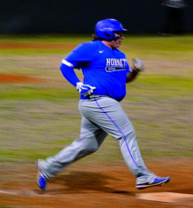 courtesy photo Christopher White rounds first base.