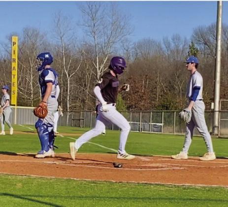 Cade Williams scores a run.