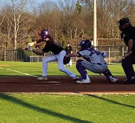 Cade Williams drops a bunt.