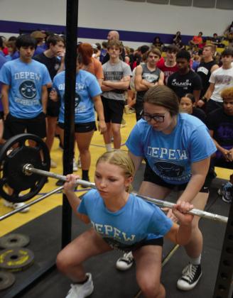 EmilyMoorespottedbyBrooklynKershmanpushingsquats.