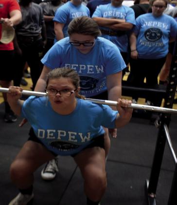 Destiny Marlin spotted by Brooklyn Kershman practicing her squats.