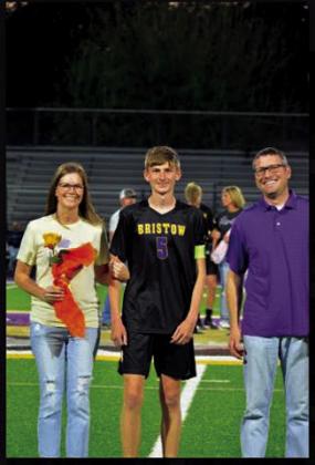Bryson Barnett with Blake and Kristin Barnett.