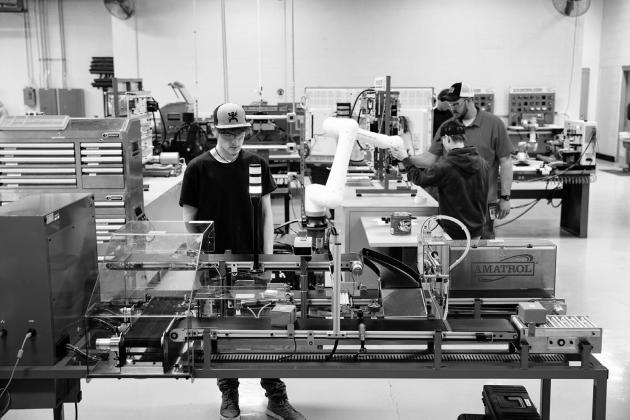 An Industrial Automation student at Central Tech practices using the Skill Boss Trainer, a mini version of what’s used at Amazon facilities. courtesy photo