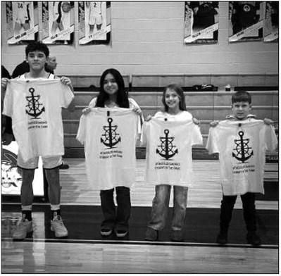 The GoldStandard represents the core values instilled by the Bristow Athletic Dept. The trait for the game was GRIT. Each of these students will represent their sites demonstrating this trait. From left. Logan McDaniel, Bristow High School, Brianna Bacenas, Bristow Middle School, Charity Stephens, Collins Elementary and Connor Smith, Edison Elementary. courtesy photo