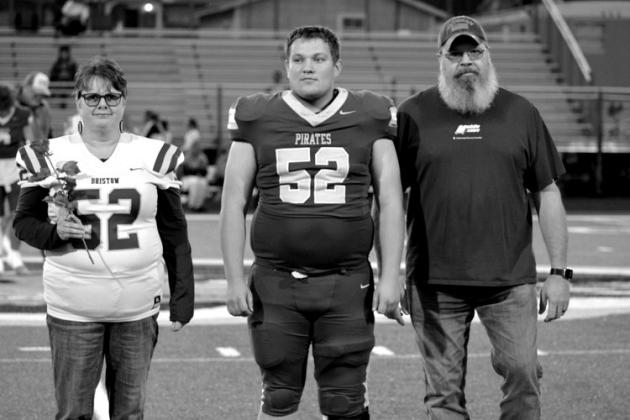Jacob Lawson with parents Todd and Paula Ostrum.