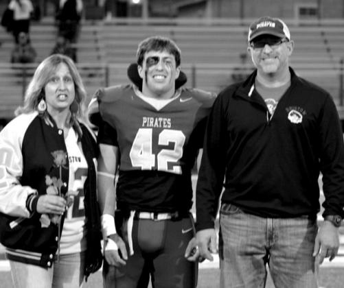Hank Powel with parents Ryan and Ashley Powell.