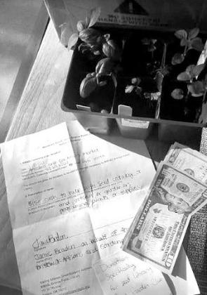 Bristow, OK Artisans and Gardeners Market makes donation to the Bristow Library Seed Catalog
