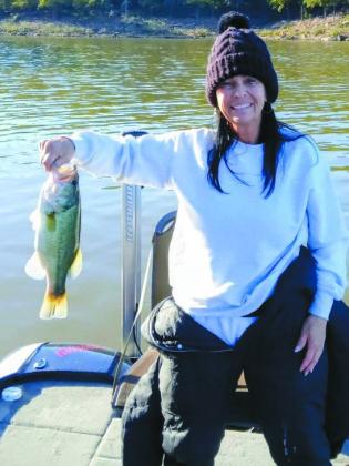 Wendy Thomas with a largemouth bass she caught while fishing at Keystone Lake. courtesy photo