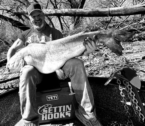 Doug Eastman with a blue catfish he caught at Grand Lake.