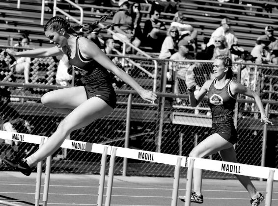 Kinzie Williams and Ava Yocham make the hurdles.