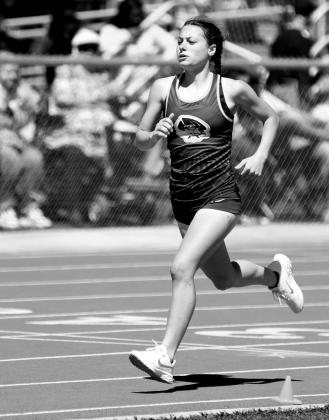 Alex Wilhite sprints around the track.