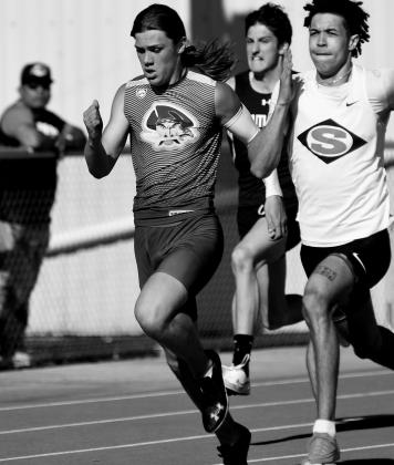 Gage Spencer runs relays.