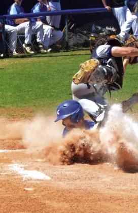 Gabe Peeler slides into home.