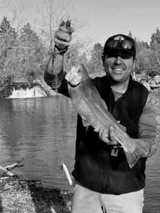 Maurizio Camacho with a rainbow trout caught at the Blue River. courtesy photo