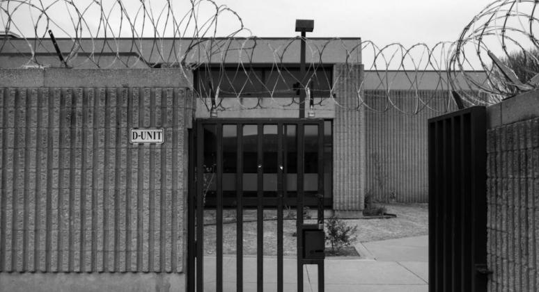 A gate is seen outside of one of the inmate housing units at Joseph Harp Correctional Center in Lexington. (Whitney Bryen/Oklahoma Watch)