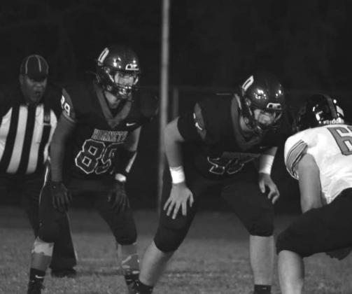The Hornets defensive team takes action.