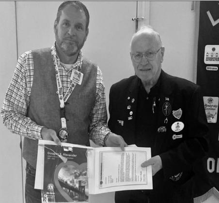 David Baker and District Governor David Wooddall.