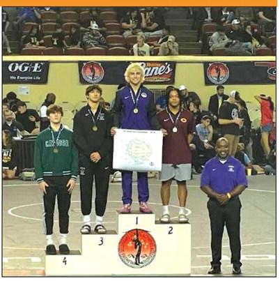 Hayden Yocam takes the podium with a first place championship at the State Wrestling Tournament. courtesy photo