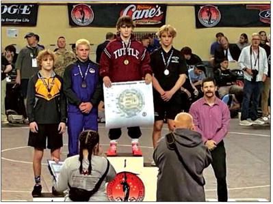 Bristow Pirate Mack Powell, takes the podium with a third place win in the tournament at the 150 pound weight class.