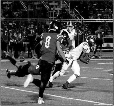 Rebecca Langston photo Charles Ware breaks threw for a first down.