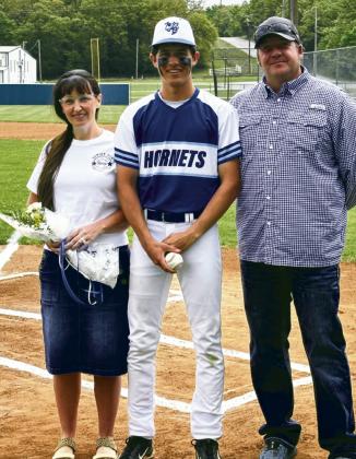 Carson Kinney with parents Mandi and Josh Kinney.