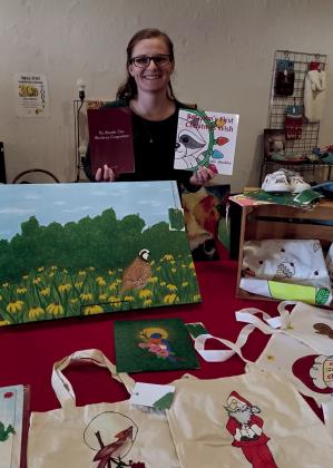 Kylie Shockley, Bramble Cave artist and author, was at The Old Crow Showroom Saturday, doing a book signing. Shockley is the author of a children’s book and a recipe book, along with being an artist, showing some of her art work during the signing. courtesy photo