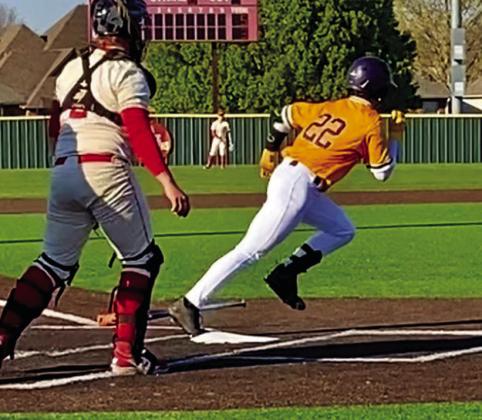 Bryce Macnac drives a hit.