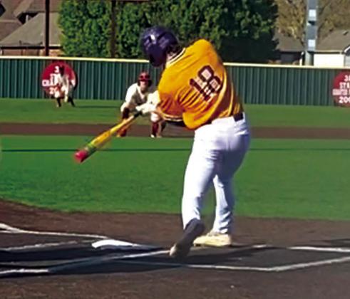 Cade Williams drives the ball.