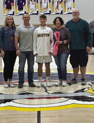 Ty Bishop with parents Len and Emily Winter and Jason and Brittney Bishop (basketball and track).