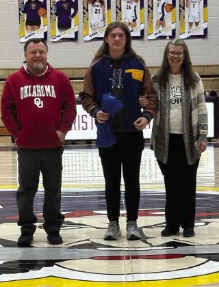 Gage Spencer with parents Joseph and Michelle Spencer (track).