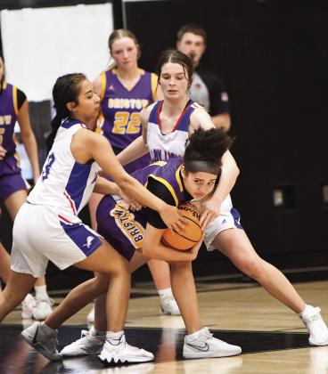 Addy Alexander keeps the opponent from a steal.