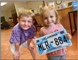 Knox and Charley Marlow in the lobby of Drumright Tag Agency courtesy photo