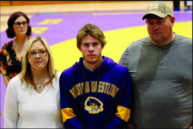 Jackson Moore with parents Nikki Moore and Joey Moore.